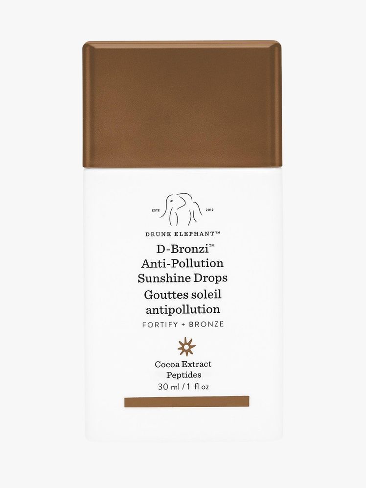 D-Bronzi Bronzing Drops with Peptides white and brown square bottle on light grey background